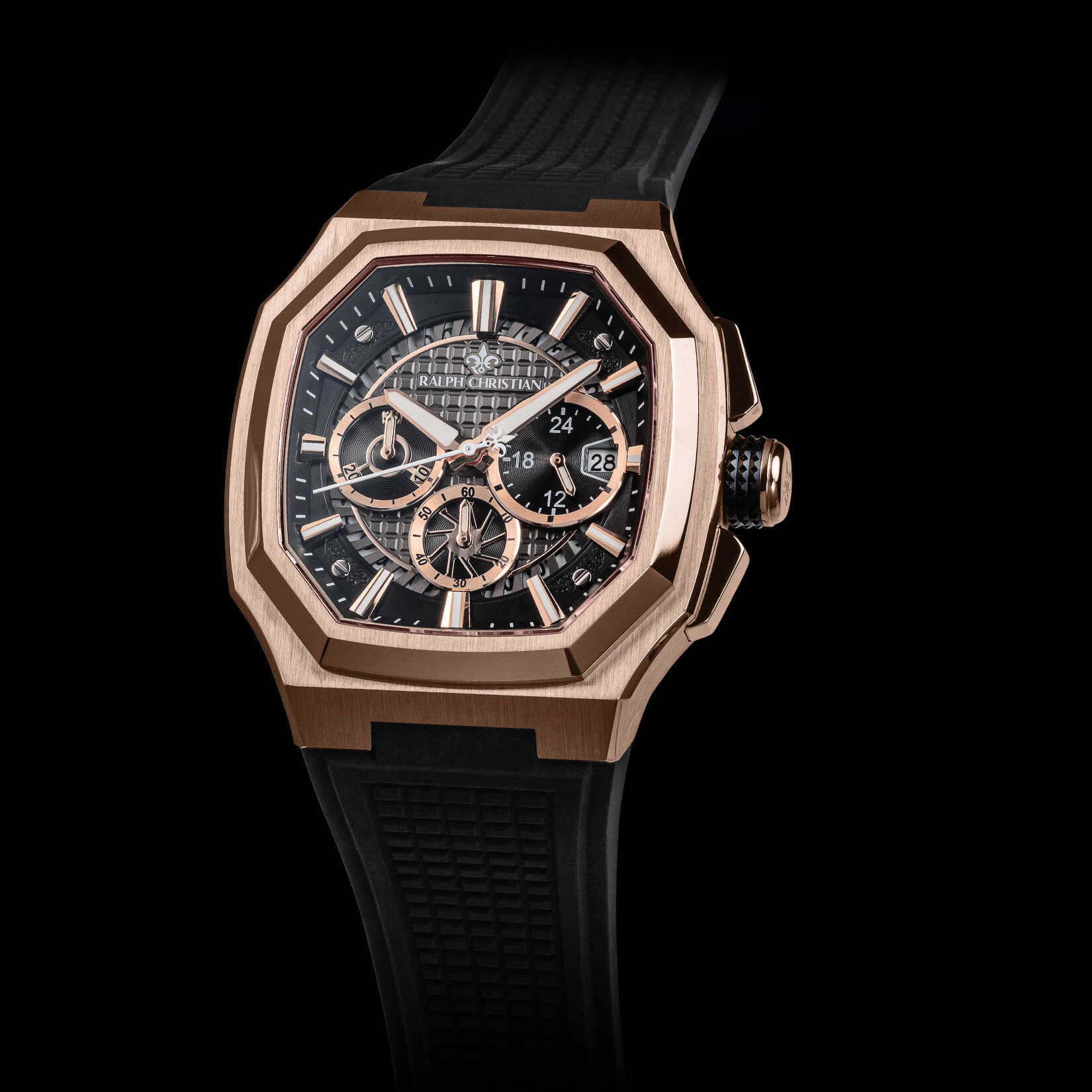 Luxury watch with black strap and rose gold case on a black background